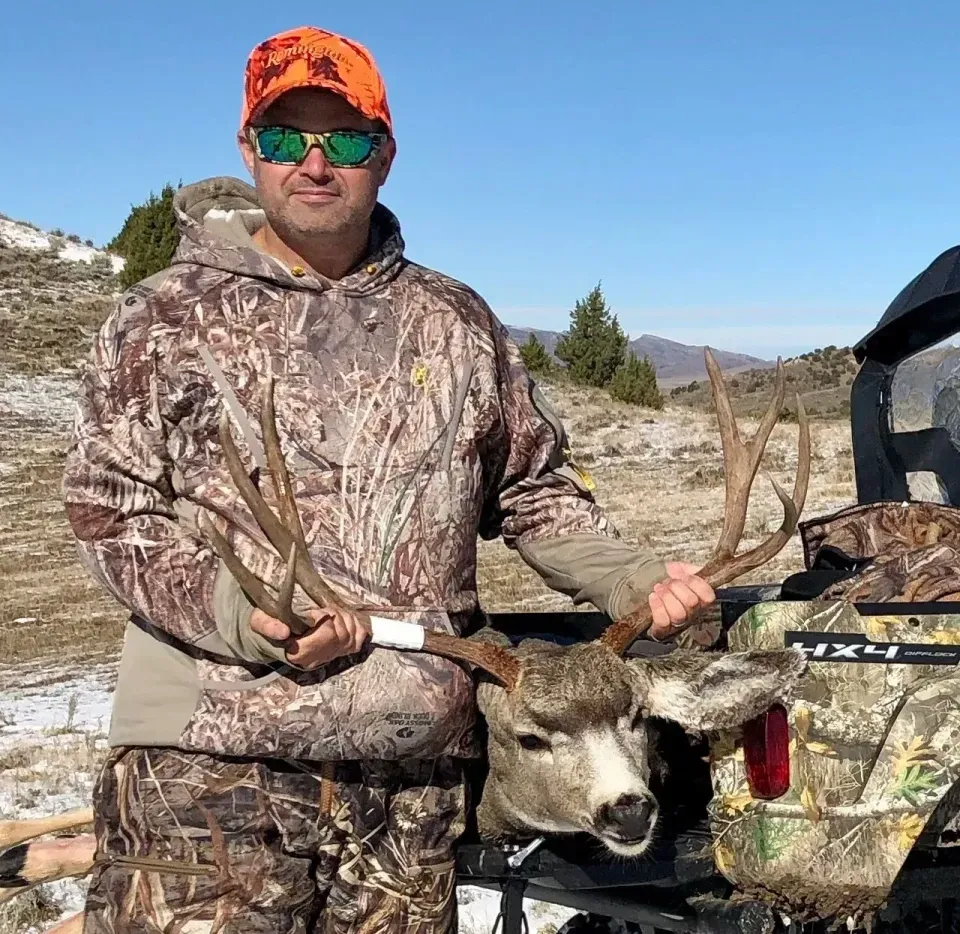 Kevin with a nice wide Muley buck he took at 190 yards. W...